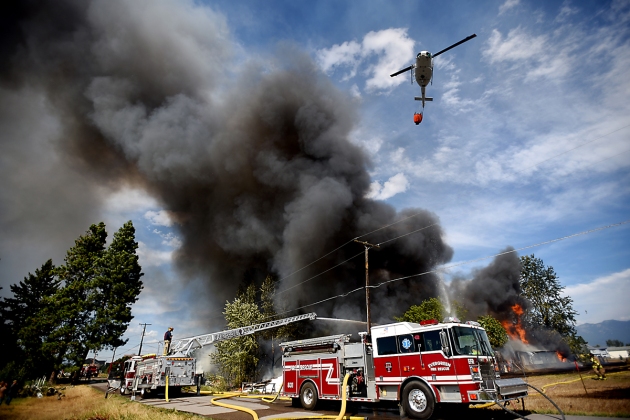 Smoke billows from a massive fire on Mountain View Drive in Evergreen on Wednesday, August 5. (Brenda Ahearn/Daily Inter Lake)