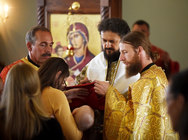 The Rev. Daniel Kirk take part in offering communion and blessings for the members of Saint Herman Orthodox Church on Sunday, July 19, in Kalispell. (Brenda Ahearn/Daily Inter Lake)